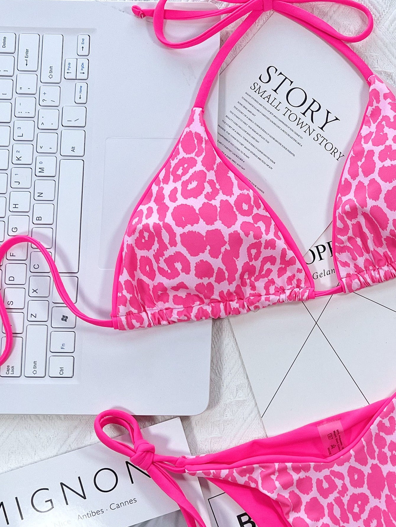 Hot Pink leopard print tie-side bikini set with adjustable straps and tie bottoms.