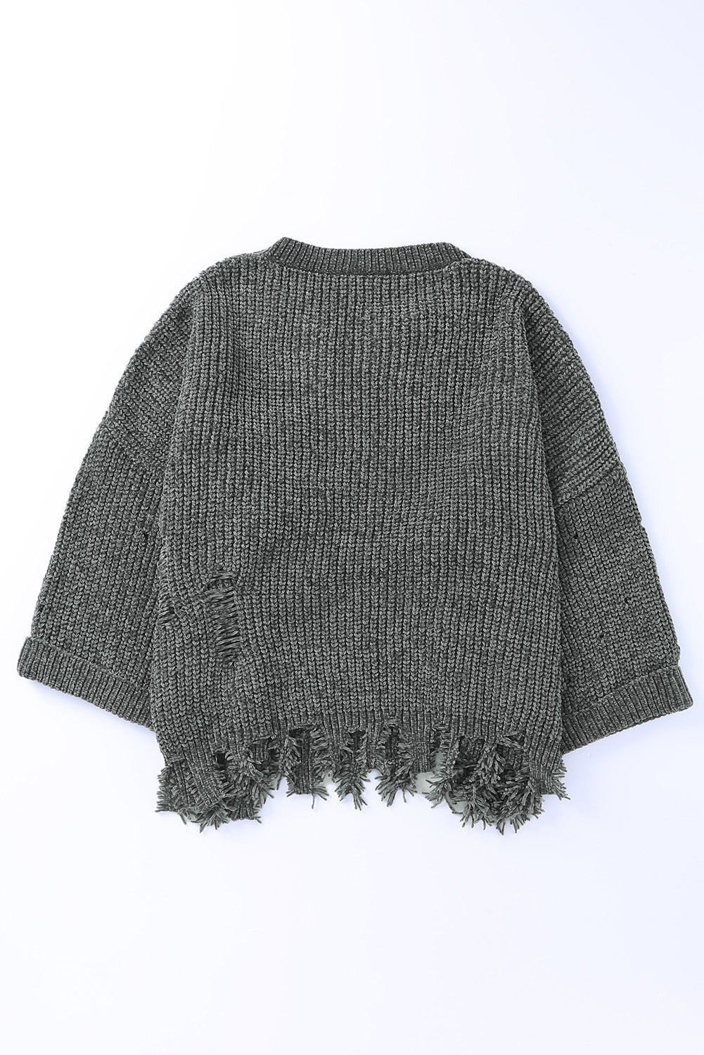 Distressed knit sweater in dark gray with frayed hem and distressed details.