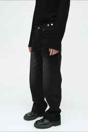Relaxed fit denim jeans in dark vintage wash with button fly.