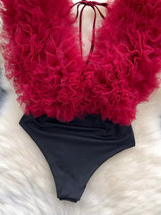 Ruffled V-neck bodysuit in black with a dramatic red ruffled tulle overlay and lace tie detail.