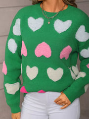 Green fuzzy knit sweater with white and pink heart embellishments.