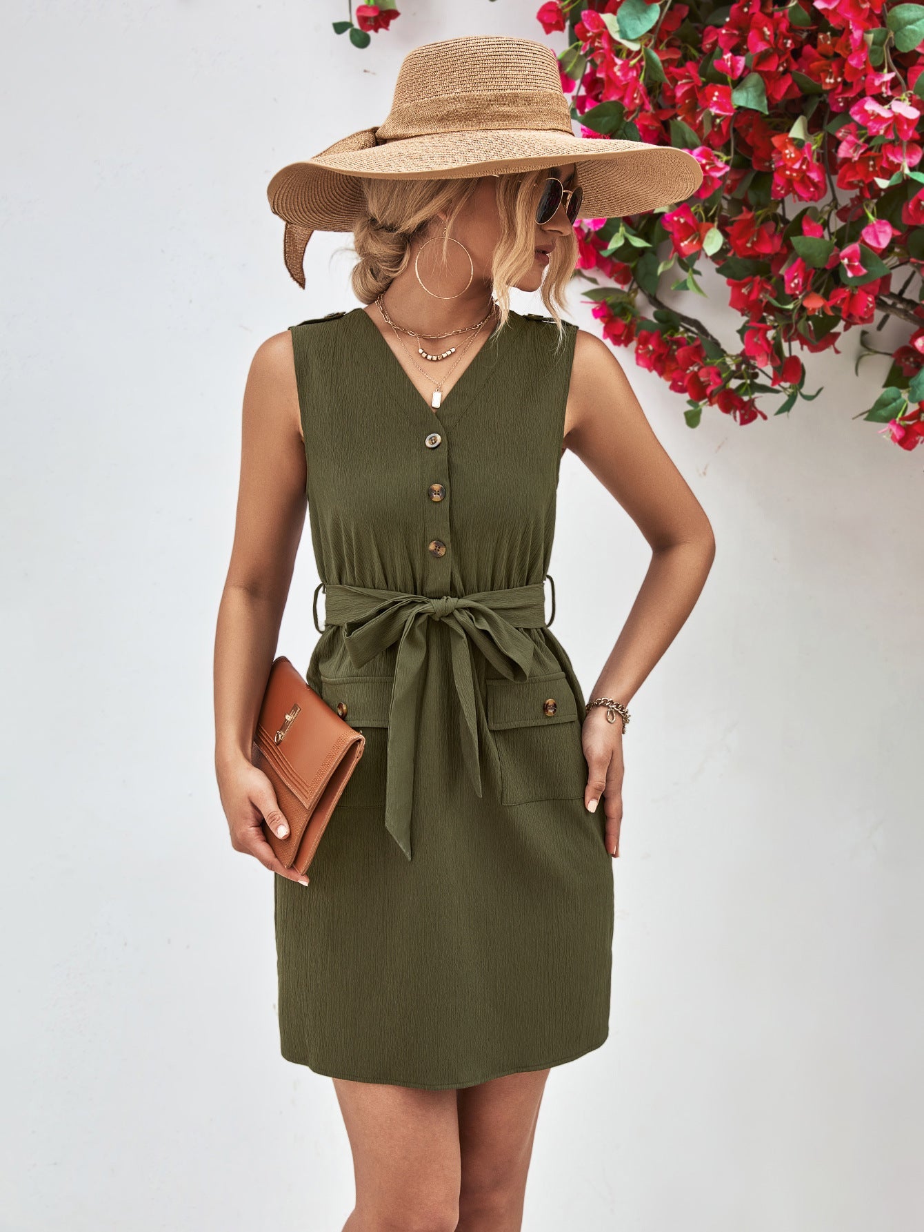 Army green button-down tie-waist sleeveless shirtdress with pockets and a belted waist.