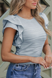 Light blue textured bodysuit with ruffle sleeves and ruched sides.
