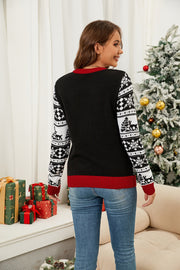 Black acrylic sweater with reindeer and snowflake Fair Isle knit sleeves and red trim.