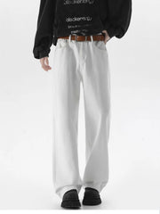 White wide-leg comfort fit jeans with a brown belt, styled casually.