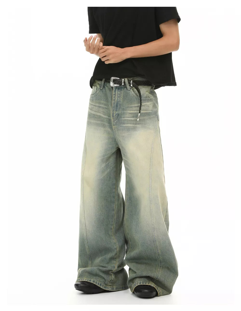 Timeless wide leg denim trousers in light wash with a relaxed fit and subtle fading.