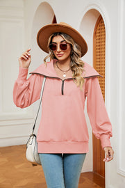 Peach wide collar zip-through sweatshirt with balloon sleeves.