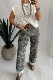 Camo print cargo jeans with cuffed ankles and utility pockets.