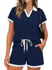 Navy blue polo collar two-piece set with white trim, drawstring shorts with pockets.