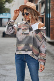 Southwestern print overshirt jacket in gray with pink and tan geometric pattern, button front, and chest pockets.