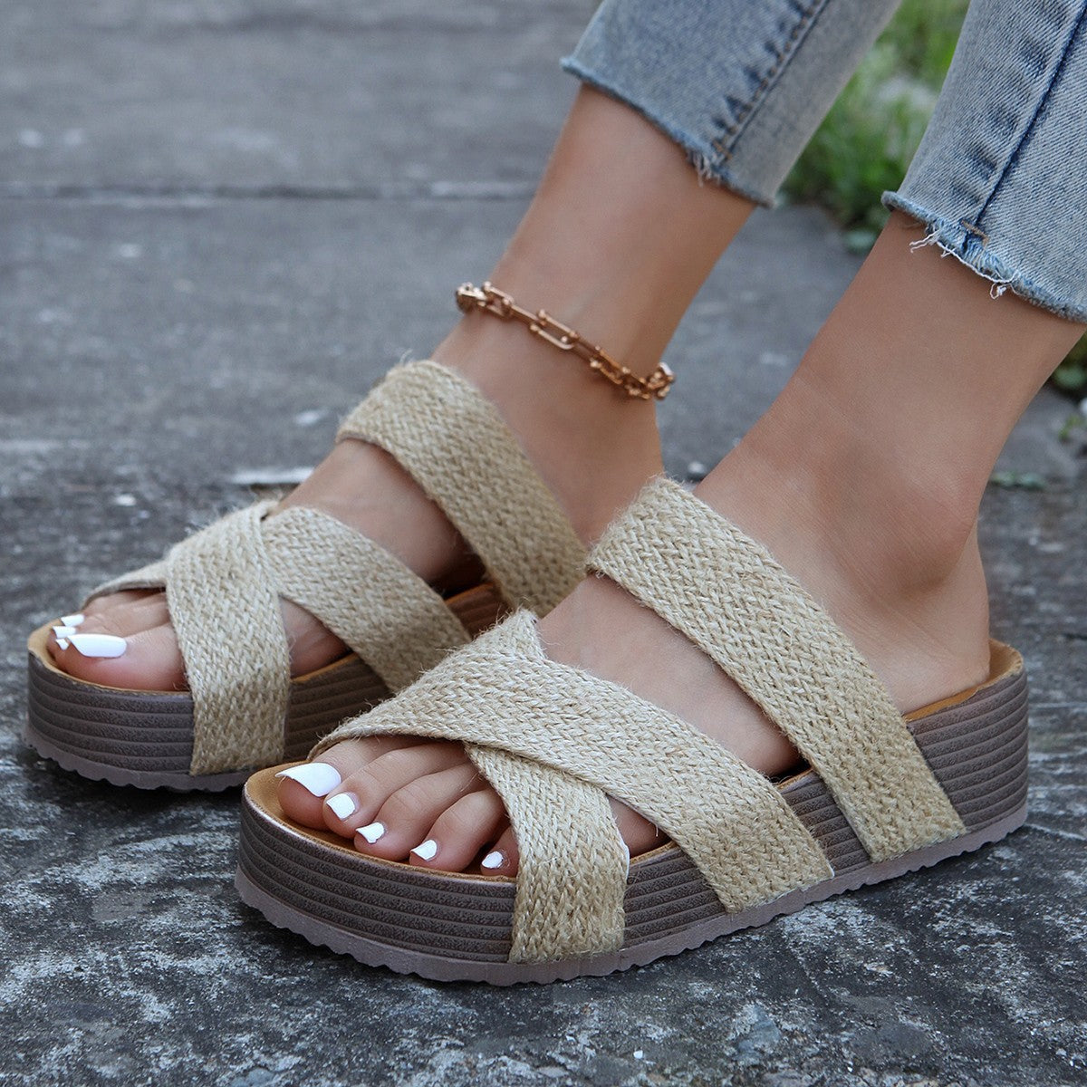 Beige braided strap platform sandals with crisscross detail and thick sole.