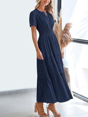 Dark navy V-neck tiered maxi dress with smocked waist and short sleeves.