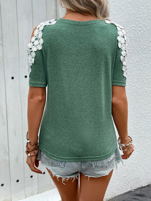 Dark green tee with white lace shoulder cutouts and short sleeves.