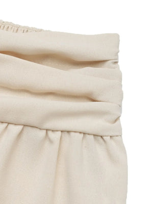 Cream ruched waistline balloon trousers with elasticated waistband detail.