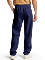 Navy blue textured drawstring sweatpants for men with elastic waistband and pockets.