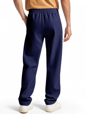 Navy blue textured drawstring sweatpants for men with elastic waistband and pockets.