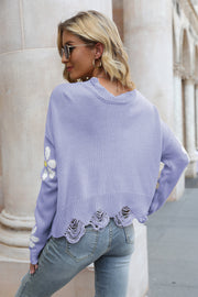 Lavender acrylic sweater with daisy appliqué and distressed hem