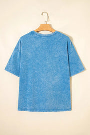 Blue acid wash cotton maternity t-shirt with short sleeves and crew neck.