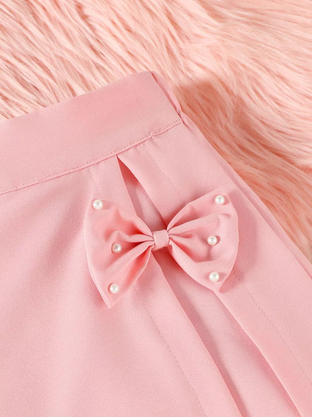 Pink baby skort with pearl-embellished bow detail