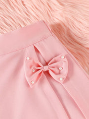 Pink baby skort with pearl-embellished bow detail