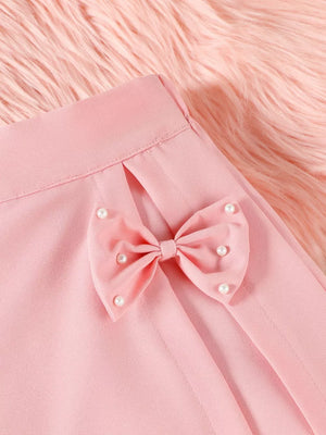 Pink baby skort with pearl-embellished bow detail