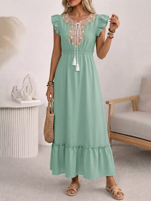 Maternity maxi dress in mint green with embroidered neckline, tie detail, ruffled sleeves and hem.