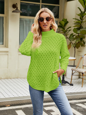 Lime green acrylic turtleneck sweater with diamond knit texture and side slits