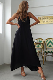 Black linen maxi dress with spaghetti straps and a flowing skirt.