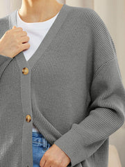 Gray ribbed knit cardigan with balloon sleeves and button front, styled with a white tee and jeans.