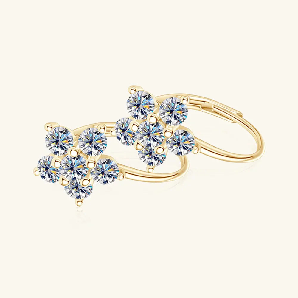 Gold celestial cluster huggie hoops with clear cubic zirconia stones.