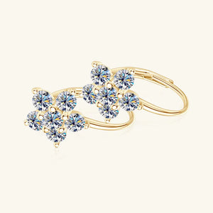 Gold celestial cluster huggie hoops with clear cubic zirconia stones.