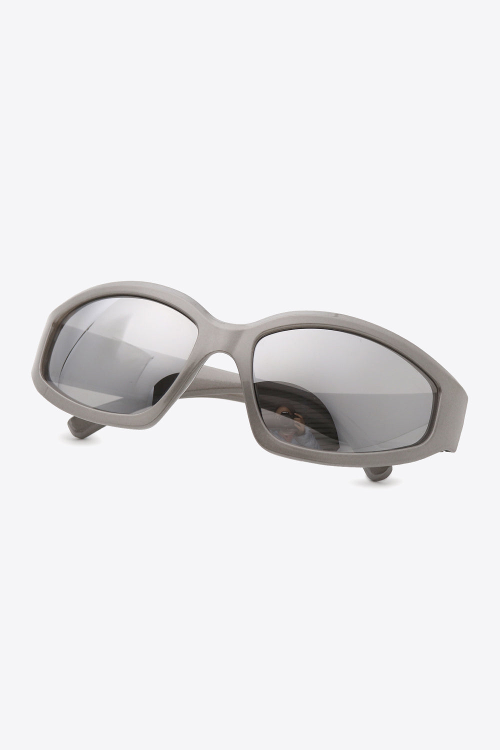 Sculpted Shield sunglasses in mid gray with mirrored lenses and a chic cat-eye shape.