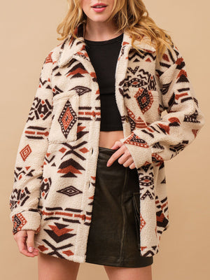 Beige sherpa overshirt jacket with bold Aztec pattern, button front and chest pockets.