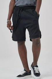 Men's black drawstring boxer shorts with pockets and a relaxed fit.