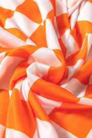 Tangerine and white checkered outfit set fabric detail