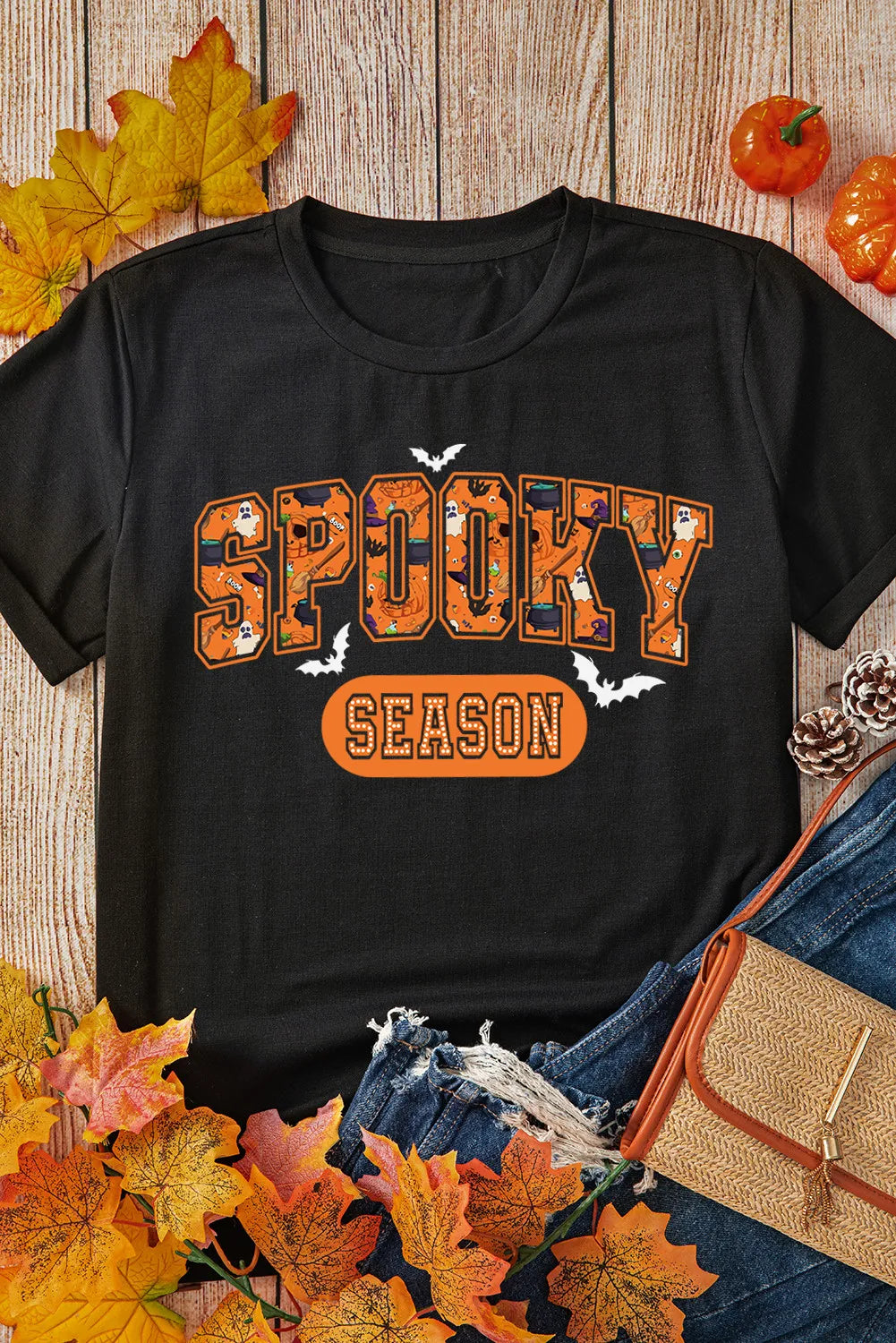 Black Halloween graphic tee with retro font and spooky season design.