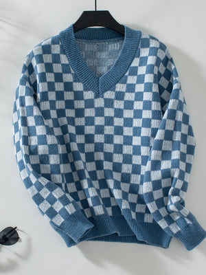 Checkerboard knit v-neck pullover sweater in dusty blue and white.