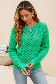 Green open-knit crewneck sweater with subtle texture and ribbed cuffs.
