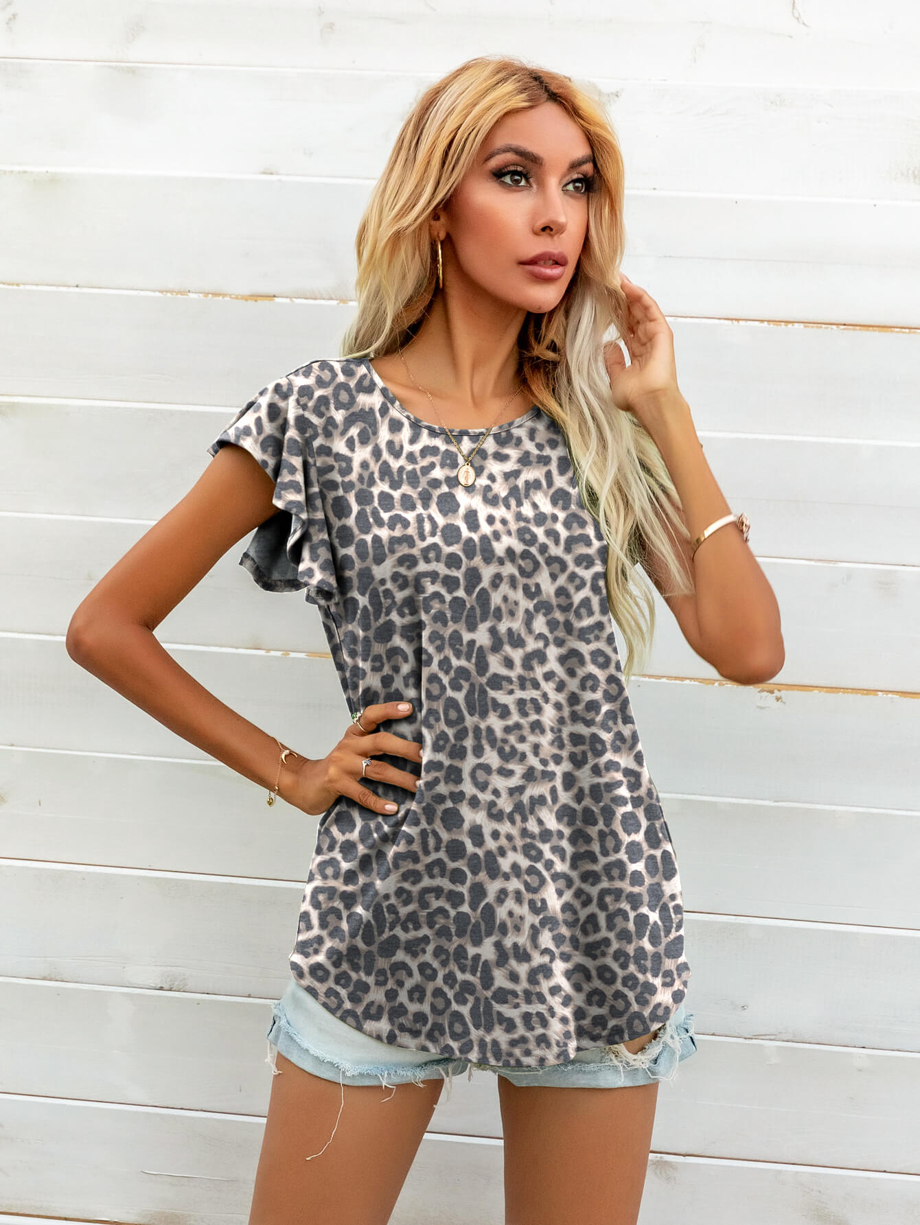 Leopard print tee with ruffled short sleeves and a crew neck.