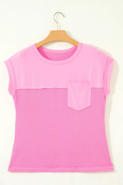Pink waffled seam pocketed t-shirt with crew neck and short sleeves.