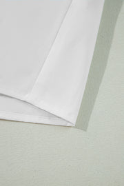 White piped trim bow blouse showing hem detail