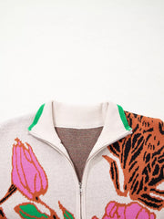 Knit quarter zip sweater with floral and tiger print, stand neck, and green collar trim.