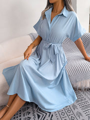 Light blue button-down midi dress with short sleeves and tie belt