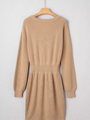 Tan ribbed knit sweater dress with long sleeves and a cinched waist.