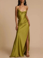 Lustrous satin maxi dress with cowl neck, spaghetti straps, and high slit.