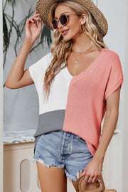 Split-tone knit tee with V-neck, dolman sleeves, and colorblock white, pink, and gray sections.