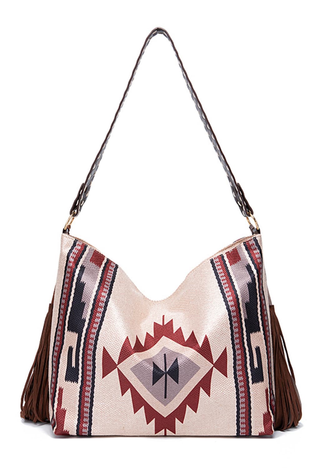 Southwestern fringe hobo bag in beige canvas with geometric pattern and brown fringe detail.
