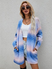 Longline knit cardigan with rainbow gradient in blue, pink, and blush, featuring pockets and an open front.