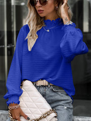 Royal Blue textured puff sleeve blouse with smocked neck and cuffs.