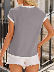 Light gray ribbed knit tee with white contrast piping and short sleeves.